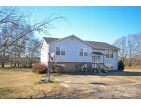 Charming two-story home with a well-maintained lawn, spacious driveway, and a basketball hoop for outdoor fun at 2725 Carla Dr, Shelby, NC 28150