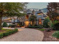 Elegant two-story home with stone accents and landscaped grounds at 300 Eagle Bend Dr, Waxhaw, NC 28173