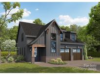 Stunning modern farmhouse with a two-car garage and beautifully landscaped front yard at 2625 Ritz Ln, Matthews, NC 28105
