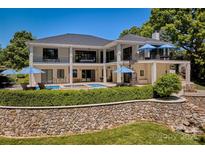 Stunning lakefront home with stone wall and pool at 104 Hidden Cove Dr, Shelby, NC 28150