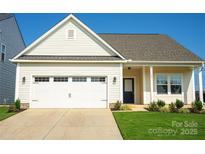 Inviting exterior of a charming single-story house with a two-car garage at 147 Fesperman Cir, Troutman, NC 28166