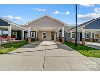 Modern craftsman style home with covered carport and brick accents at 1511 28Th Street Se Pl, Hickory, NC 28602