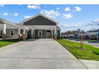 Gray exterior with carport and landscaped lawn at 1529 28Th Street Se Pl, Hickory, NC 28602