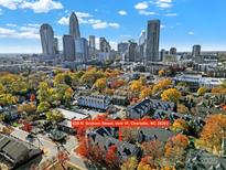 Stunning aerial view of the city skyline with colorful fall foliage and the condo at 529 N. Graham St. Unit 1F at 529 Graham St # 1F, Charlotte, NC 28202
