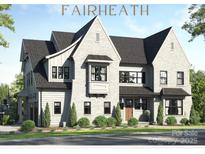 Two-story home with gray brick and stylish architectural details at 4839 Fairheath Rd, Charlotte, NC 28210