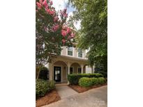 Two-story house with front porch and landscaping at 11620 Galashiels Dr, Huntersville, NC 28078