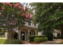 Two-story house with front porch and landscaping at 11620 Galashiels Dr, Huntersville, NC 28078
