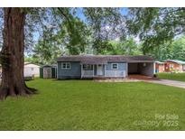 Newly renovated blue house with carport and storage shed at 4972 Mayble St, Catawba, NC 28609