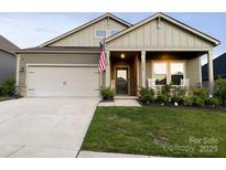 Beautiful two-story home with a welcoming front porch and landscaped lawn at 3524 Tully Ave, Kannapolis, NC 28081