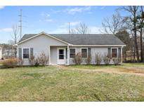 Charming single-story home with light gray siding, green shutters, and a well-maintained front lawn at 101 Turner Dr, Clover, SC 29710