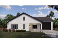 Modern farmhouse exterior with covered porch and two-car garage at 13251 Sam Furr Rd, Huntersville, NC 28078