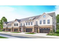 Charming townhome row featuring modern design, two-car garages, brick accents, and manicured landscaping at 5051 Elm View Dr # 26, Charlotte, NC 28277