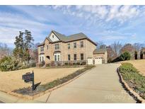 Brick house with a two-car garage and landscaped lawn at 625 Highland Ridge Pt, Clover, SC 29710