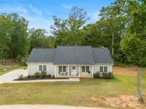 Charming one-story house with gray roof and landscaped yard at 1706 Ivey Ct, Maiden, NC 28650