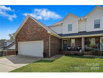 Brick front exterior of two-story home with attached garage at 905-A Linney Ln, Shelby, NC 28152