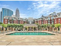 Stunning pool area surrounded by upscale buildings and lush landscaping at 300 W 5Th St # 402, Charlotte, NC 28202