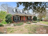 Brick home with a large front porch and walkway at 515 S Academy St, Lincolnton, NC 28092