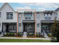 Charming two-story townhome featuring a cozy front porch and stylish gray siding at 433 Nathaniel Way # Brx0033, Charlotte, NC 28213