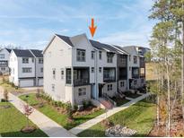 Charming townhome with a modern design, landscaped front yard, and inviting entryway at 428 Nathaniel Way # Brx0044, Charlotte, NC 28213