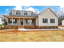 Charming one-story home with a welcoming front porch and dormer windows at 751 White Jenkins Rd, Bessemer City, NC 28016