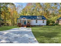 Charming craftsman style home with a welcoming front porch and landscaped yard at 312 General As Johnston St, Stanley, NC 28164