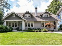 Charming craftsman-style home featuring a well-manicured lawn and welcoming front porch at 2110 E 5Th St, Charlotte, NC 28204