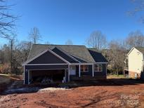 New construction home with gray siding and a two-car garage at 59 Browning Dr, Taylorsville, NC 28681