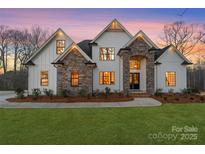 Stunning two-story home with stone accents and a landscaped lawn at 3001 Sparrow Springs Rd, Gastonia, NC 28052