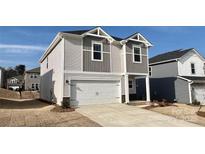 Charming two-story home featuring a white garage door and neutral siding in a suburban neighborhood at 157 Shepherds Landing Dr, Mooresville, NC 28115