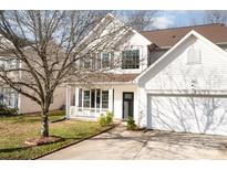 Charming two-story home with well-maintained lawn, landscaping, and a two-car garage at 4741 Nijinsky Ct, Charlotte, NC 28216