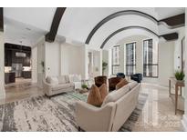 Spacious living area with arched ceilings and city views at 127 Tryon N St # 503, Charlotte, NC 28202