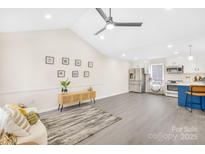 Open living room and kitchen with stainless steel appliances and stylish island at 1025 Bethel Church Rd, Lincolnton, NC 28092