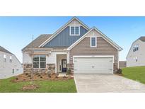 Two-story home with gray and blue siding, stone accents, and a two-car garage at 4469 Doyle Ridge Rd, Maiden, NC 28650