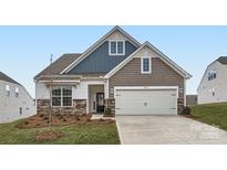 Two-story home with gray and blue siding, stone accents, and a two-car garage at 4469 Doyle Ridge Rd, Maiden, NC 28650