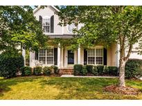 Two-story house with front porch and landscaped lawn at 9826 Edinburgh Ln # 282, Charlotte, NC 28269