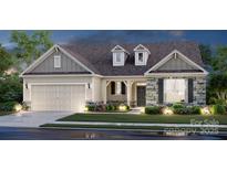 Charming single-story home featuring a stone facade, dormer windows, and a two-car garage at 121 Brooke Forest Ct, Mooresville, NC 28115
