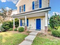 Two-story house with blue shutters and a blue front door at 16518 Ambassador Park Dr, Huntersville, NC 28078