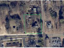 An aerial view of the property with a clearly defined boundary, surrounded by roads and local neighborhood amenities at 305 Huntersville Concord Rd, Huntersville, NC 28078