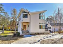 Modern two-story home with white siding and a stone walkway at 569 Evergreen Rd, Clover, SC 29710