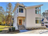 Modern two-story home with wood-toned front door and stone steps at 569 Evergreen Rd, Clover, SC 29710