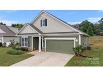 House exterior with two-car garage and landscaping at 3735 Norman View Dr, Sherrills Ford, NC 28673