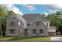 Two-story house with stone accents and a landscaped lawn at 8115 Farm Crossing Ln # 3, Huntersville, NC 28078