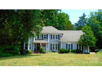 Charming two-story home with landscaped yard, covered porch, and beautiful curb appeal at 3664 Gaston Day School Rd, Gastonia, NC 28056