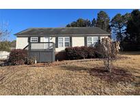 Ranch style home with deck and landscaped yard at 1520 Yellowstone Ct, Gastonia, NC 28054