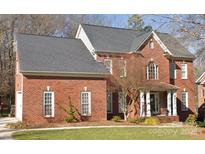 Brick two-story house with attached garage and landscaped lawn at 3481 Fieldstone Dr, Gastonia, NC 28056
