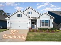 Gray two-story house with a two-car garage and landscaping at 5043 Antebellum Dr, Iron Station, NC 28080
