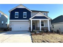 Two-story home with gray and blue siding, a white door, and a two-car garage at 3014 Cunningham Farm Dr, Indian Trail, NC 28079