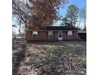 Charming brick home with a cozy front yard, offering a classic and inviting curb appeal at 1314 Milan Rd, Charlotte, NC 28216