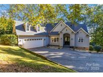 Two-story home with attached garage and landscaping at 2817 Lakefront Dr, Belmont, NC 28012