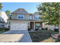 Two-story house with gray siding, stone accents, and a two-car garage at 628 Barcroft Ln, Fort Mill, SC 29715